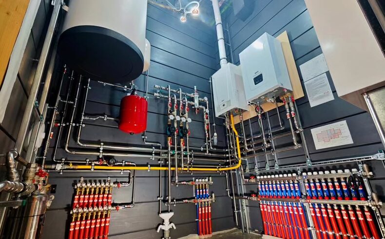 Utility Room Tankless & Manifold Build-Out in Calallen