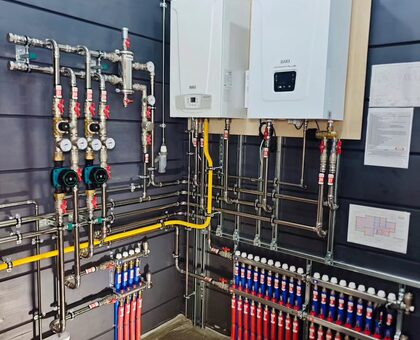 Utility Room Tankless & Manifold Build-Out in Calallen